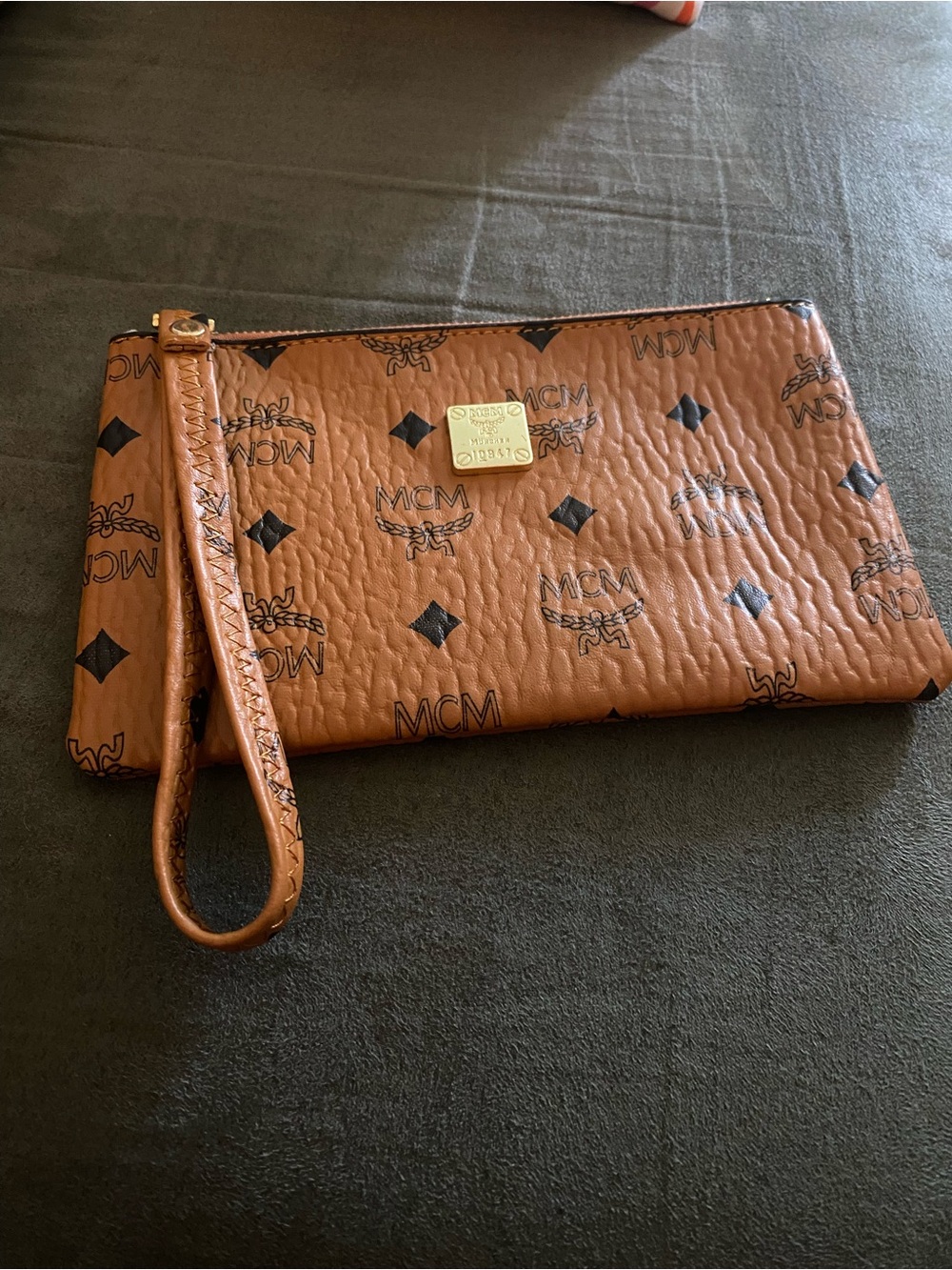 MC Brown Logo Visetos Wristlet Clutch with Gold Plaque